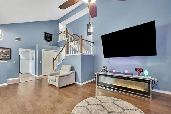 a living room with furniture and a flat screen tv