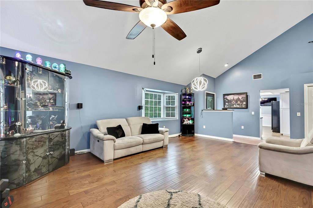 46 Greentree Street Homosassa, FL 34446 - Photo 5 of 49 a living room with furniture and a large window