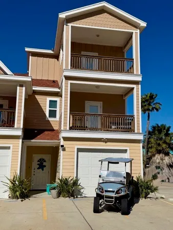a view of a car park in front of house