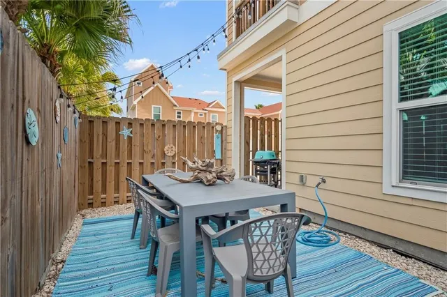 a view of a deck with furniture and wooden floor