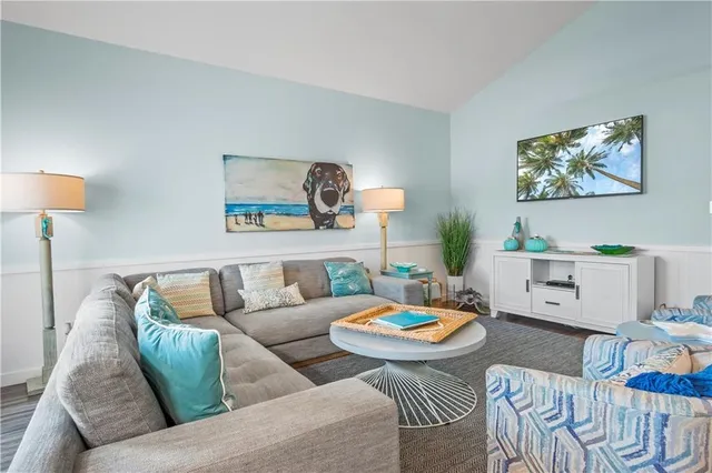 a kitchen with stainless steel appliances granite countertop a sink and a refrigerator