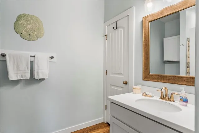 a bathroom with a shower curtain and a toilet
