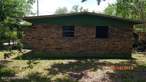 3322 Nancy Street Jacksonville, FL 32209 - Photo 2 of 13 a front view of a house with a yard