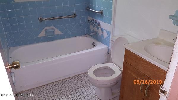 3322 Nancy Street Jacksonville, FL 32209 - Photo 10 of 13 a bathroom with a sink and a toilet