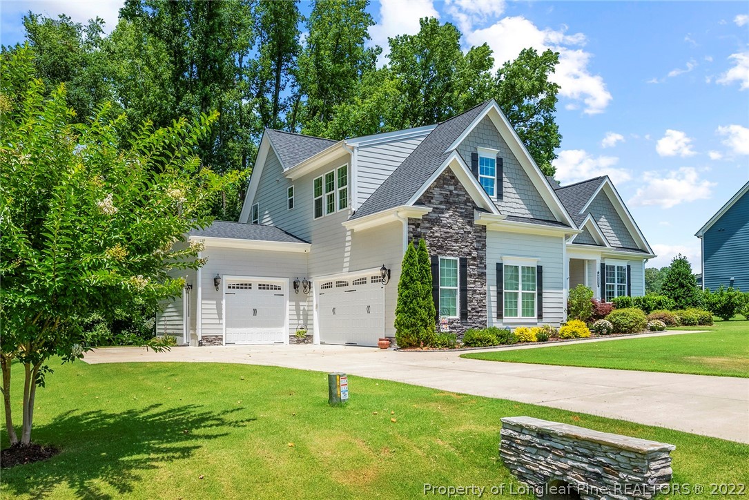 4139 Olde Judd Drive Willow Spring, NC 27592 - Photo 2 of 42 a front view of a house with a yard