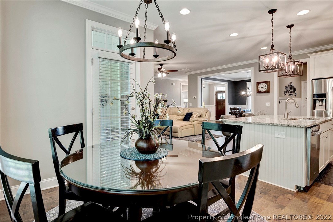 4139 Olde Judd Drive Willow Spring, NC 27592 - Photo 21 of 42 a view of a dining room with furniture and chandelier
