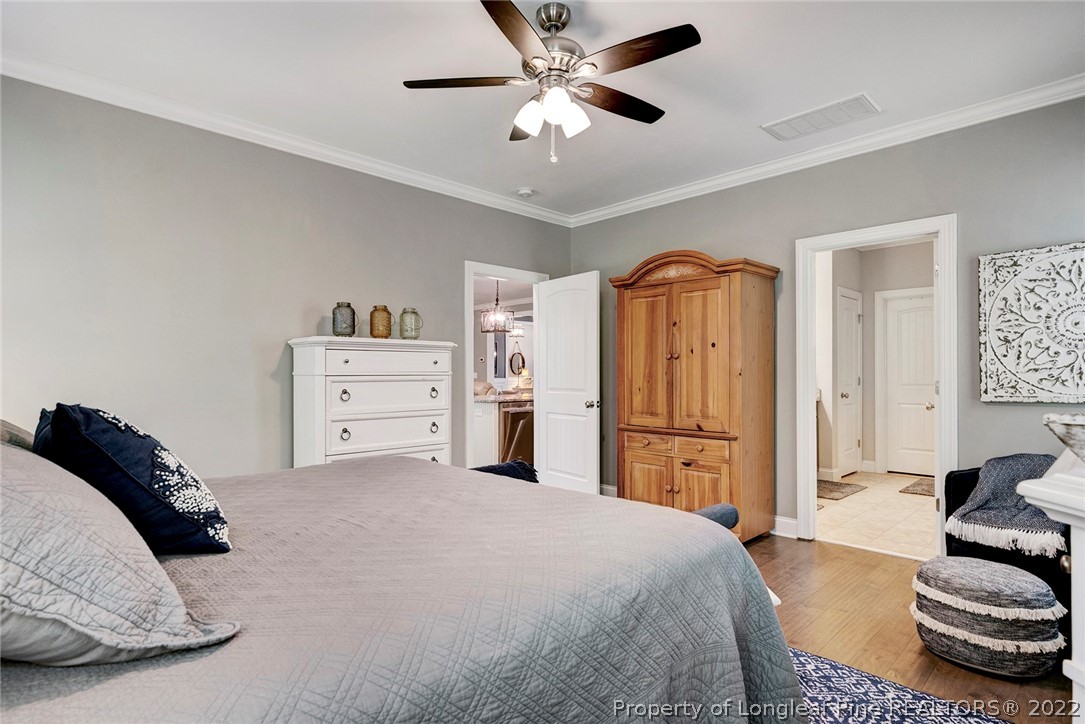 4139 Olde Judd Drive Willow Spring, NC 27592 - Photo 23 of 42 a spacious bedroom with a bed and ceiling fan