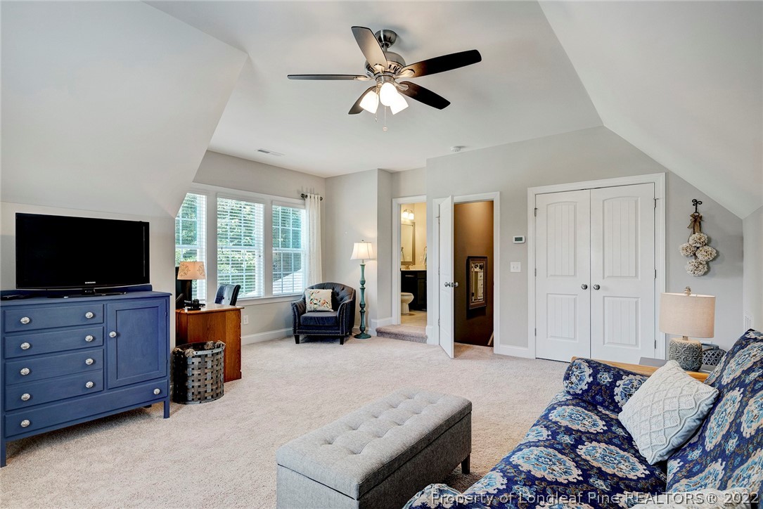 4139 Olde Judd Drive Willow Spring, NC 27592 - Photo 32 of 42 a living room with furniture and a flat screen tv