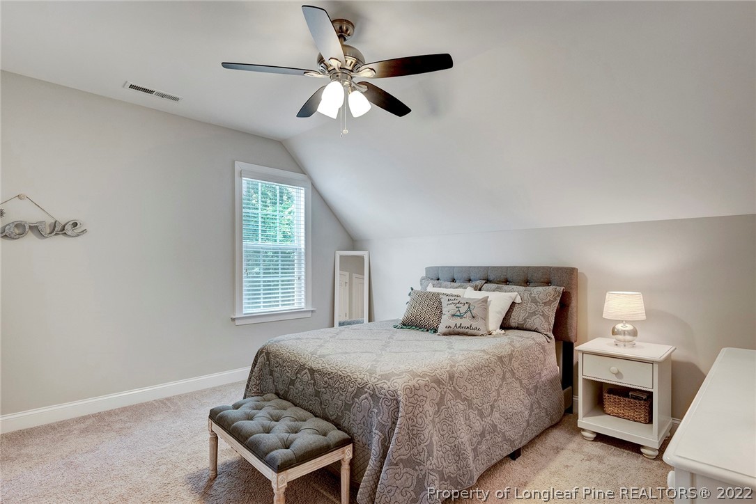 4139 Olde Judd Drive Willow Spring, NC 27592 - Photo 34 of 42 a bedroom with a bed and a ceiling fan