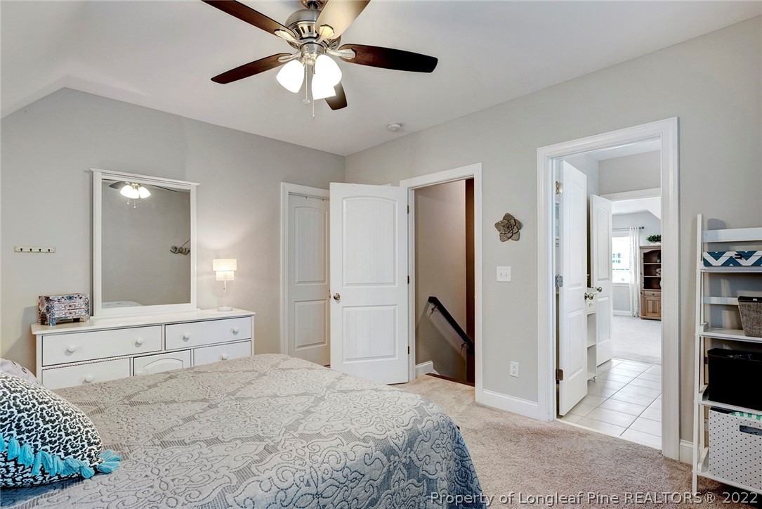 4139 Olde Judd Drive Willow Spring, NC 27592 - Photo 35 of 42 a spacious bedroom with a bed and a flat screen tv