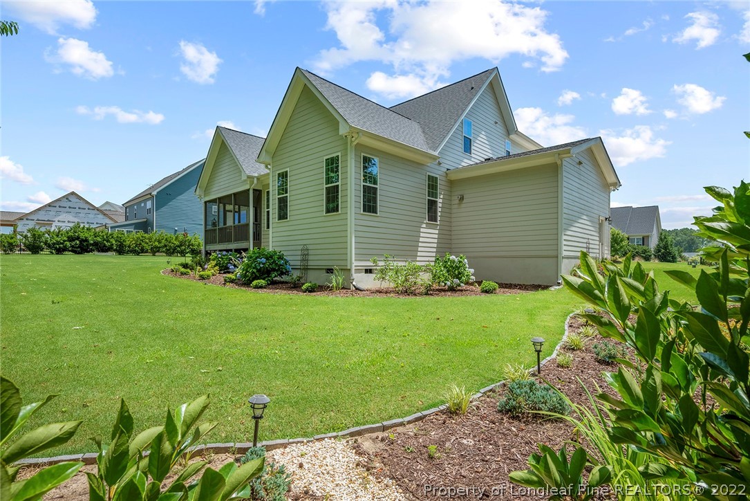4139 Olde Judd Drive Willow Spring, NC 27592 - Photo 40 of 42 a front view of a house with a garden