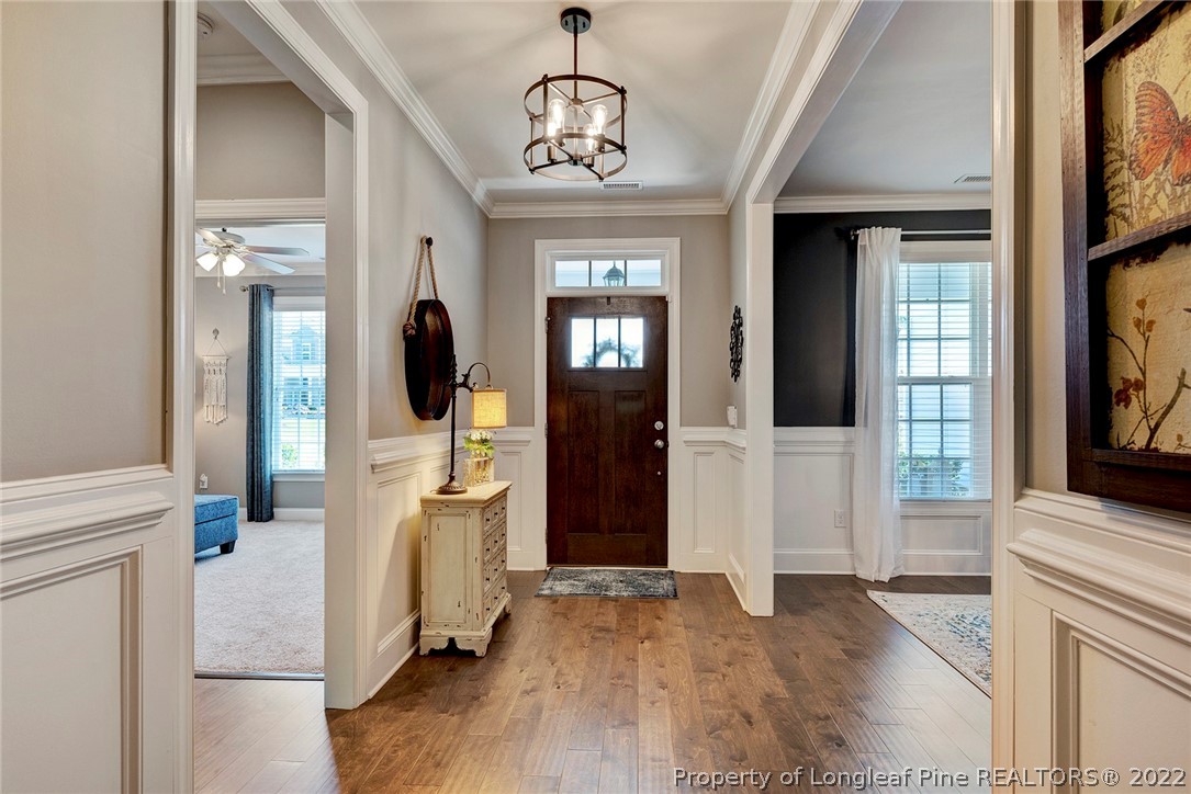 4139 Olde Judd Drive Willow Spring, NC 27592 - Photo 5 of 42 a view of a hallway with wooden floor and dining room