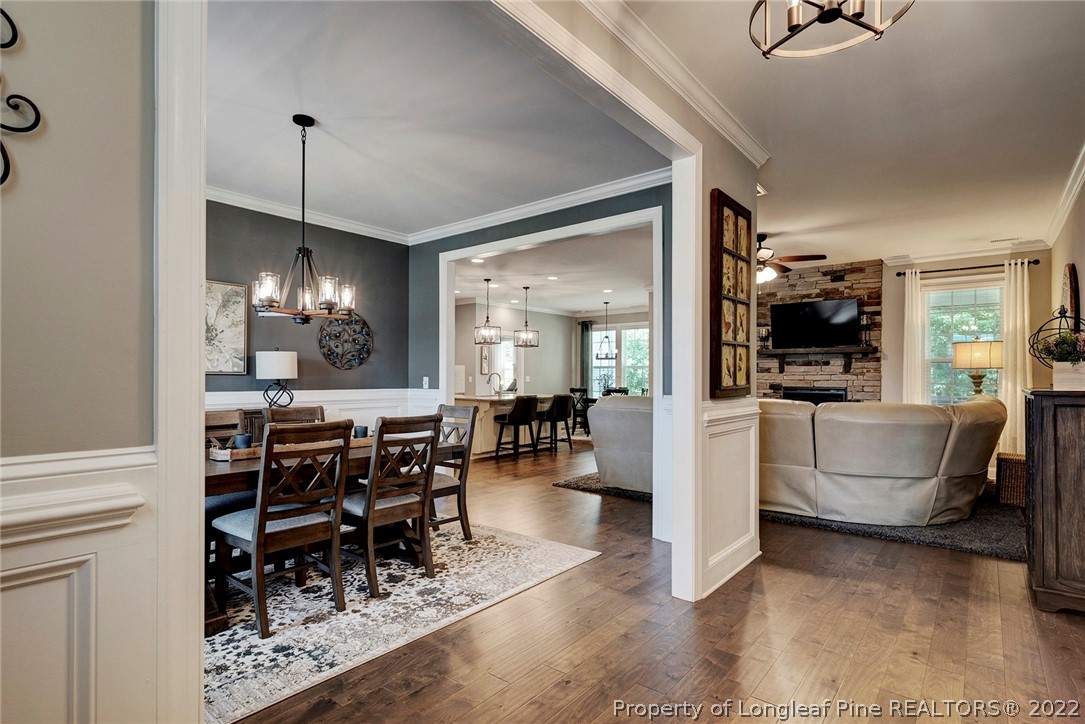 4139 Olde Judd Drive Willow Spring, NC 27592 - Photo 6 of 42 a view of a dining room with furniture wooden floor and chandelier