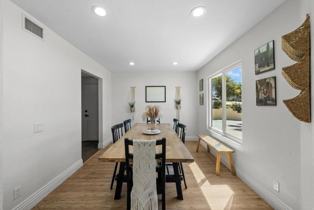 41910 Humber Drive Temecula, CA 92591 - Photo 12 of 40 a view of a dining room with furniture and wooden floor
