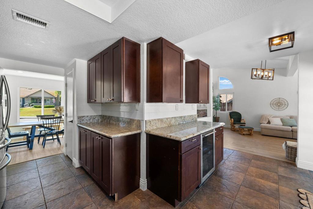 41910 Humber Drive Temecula, CA 92591 - Photo 16 of 40 a kitchen with a stove a sink and a refrigerator