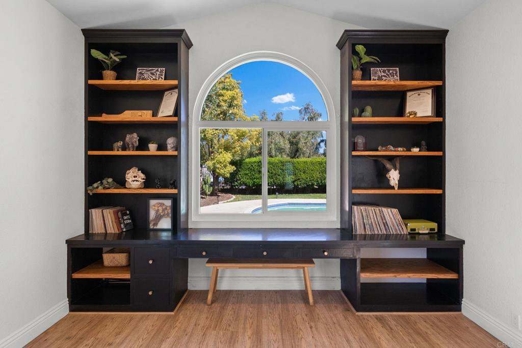 41910 Humber Drive Temecula, CA 92591 - Photo 20 of 40 a room with multiple furniture and a book shelf