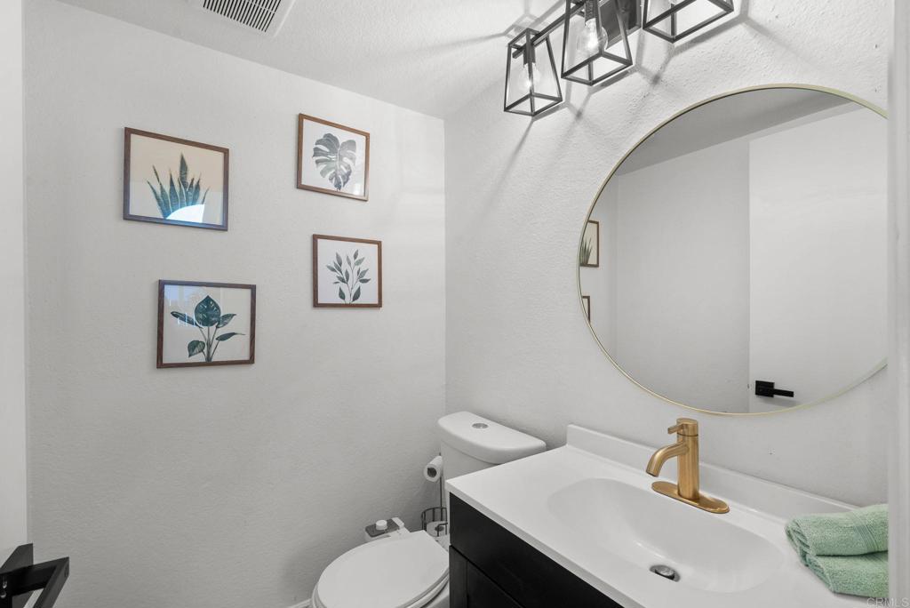 41910 Humber Drive Temecula, CA 92591 - Photo 22 of 40 a bathroom with a sink mirror and toilet