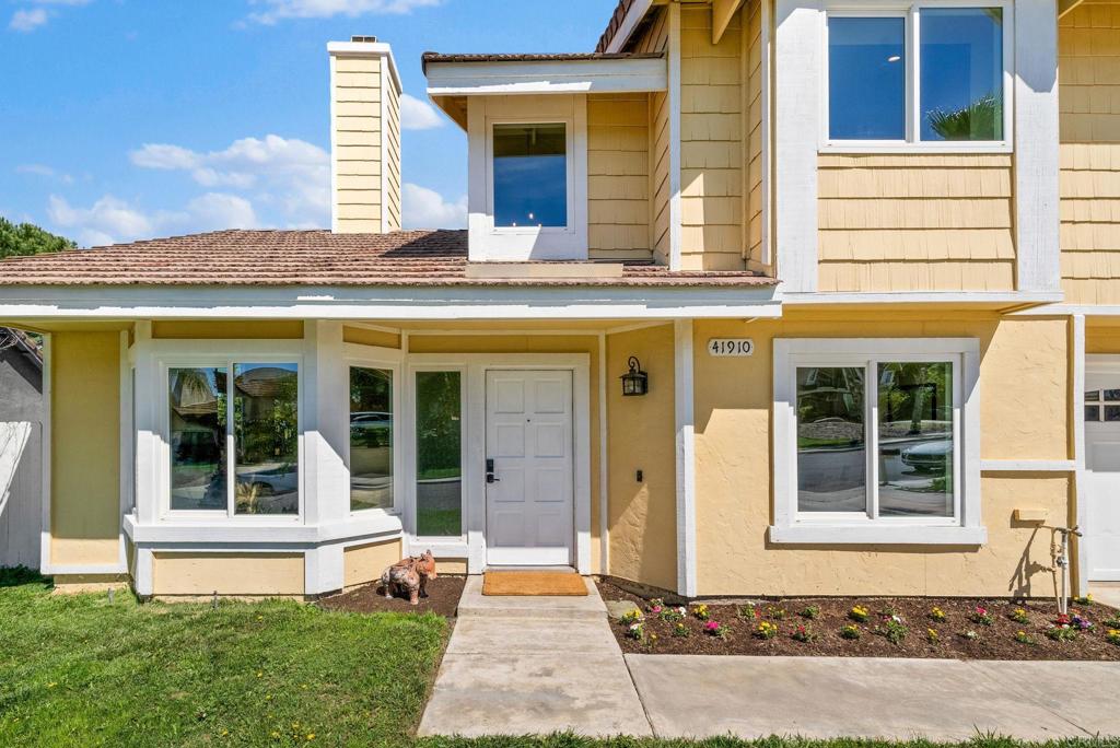 41910 Humber Drive Temecula, CA 92591 - Photo 8 of 40 a front view of a house with a yard