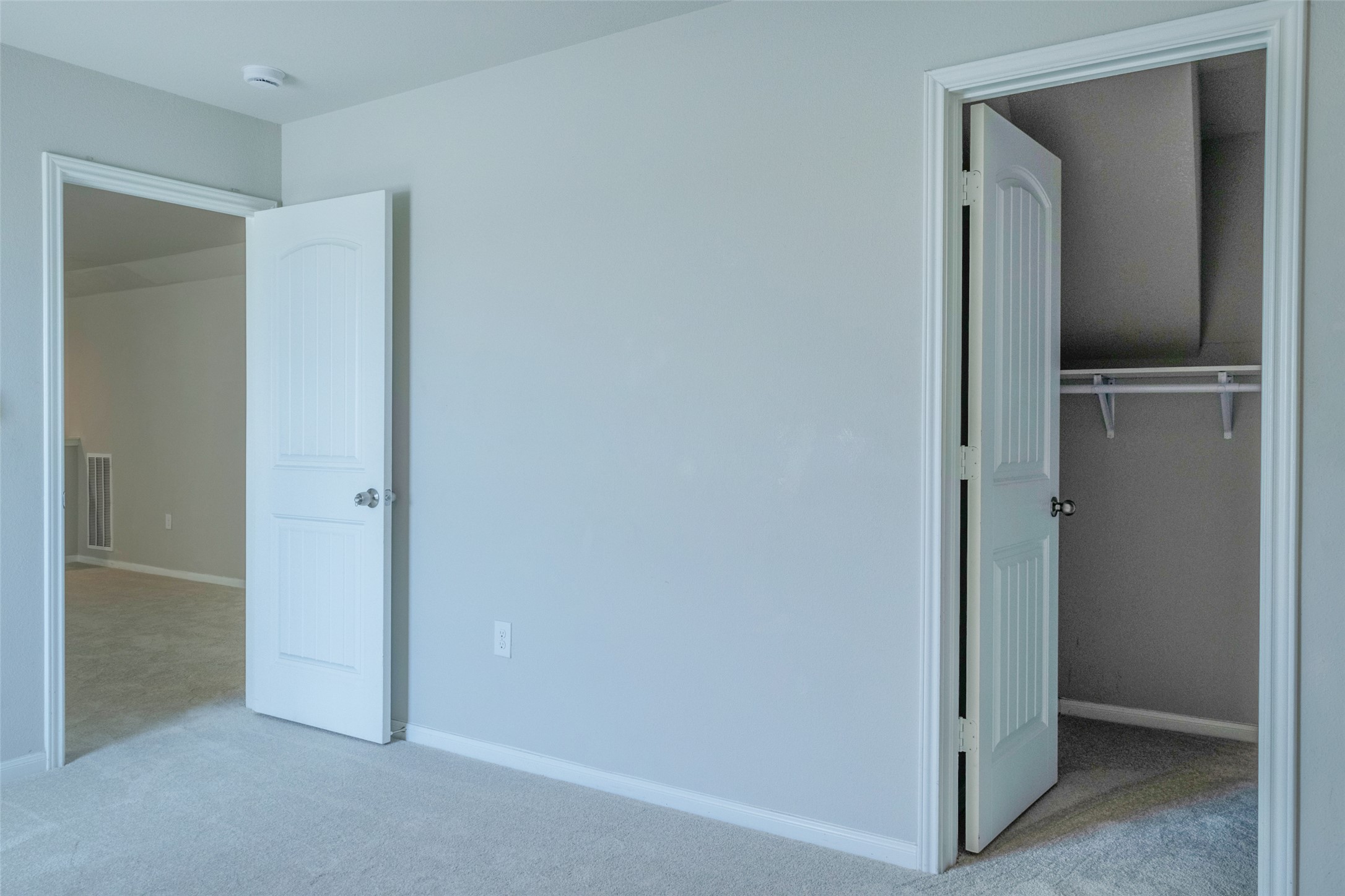 7225 Ranchito Drive Austin, TX 78744 - Photo 25 of 39 Two doorways beckon, one revealing a spacious closet, the other an adjacent room.