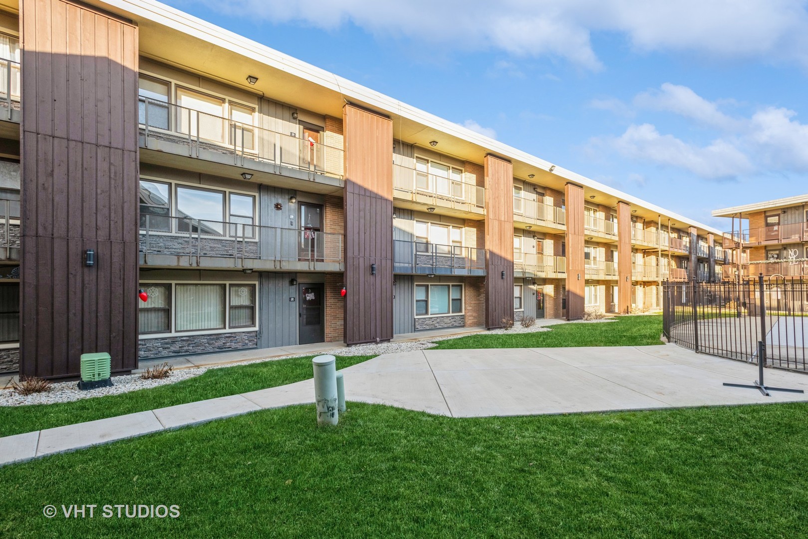 9622 West Higgins Road, Unit 2DS Rosemont, IL 60018 - Photo 3 of 14 a view of a building with a yard