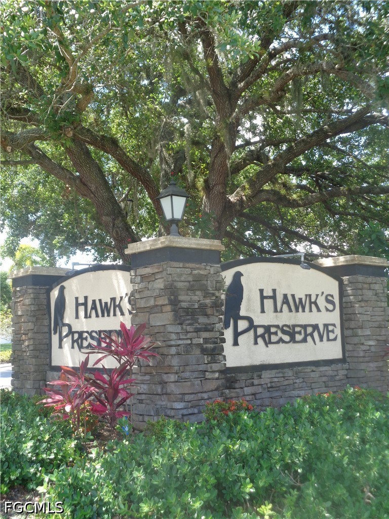 2463 Nature Pointe Loop Fort Myers, FL 33905 - Photo 49 of 50 a sign on the side of a building