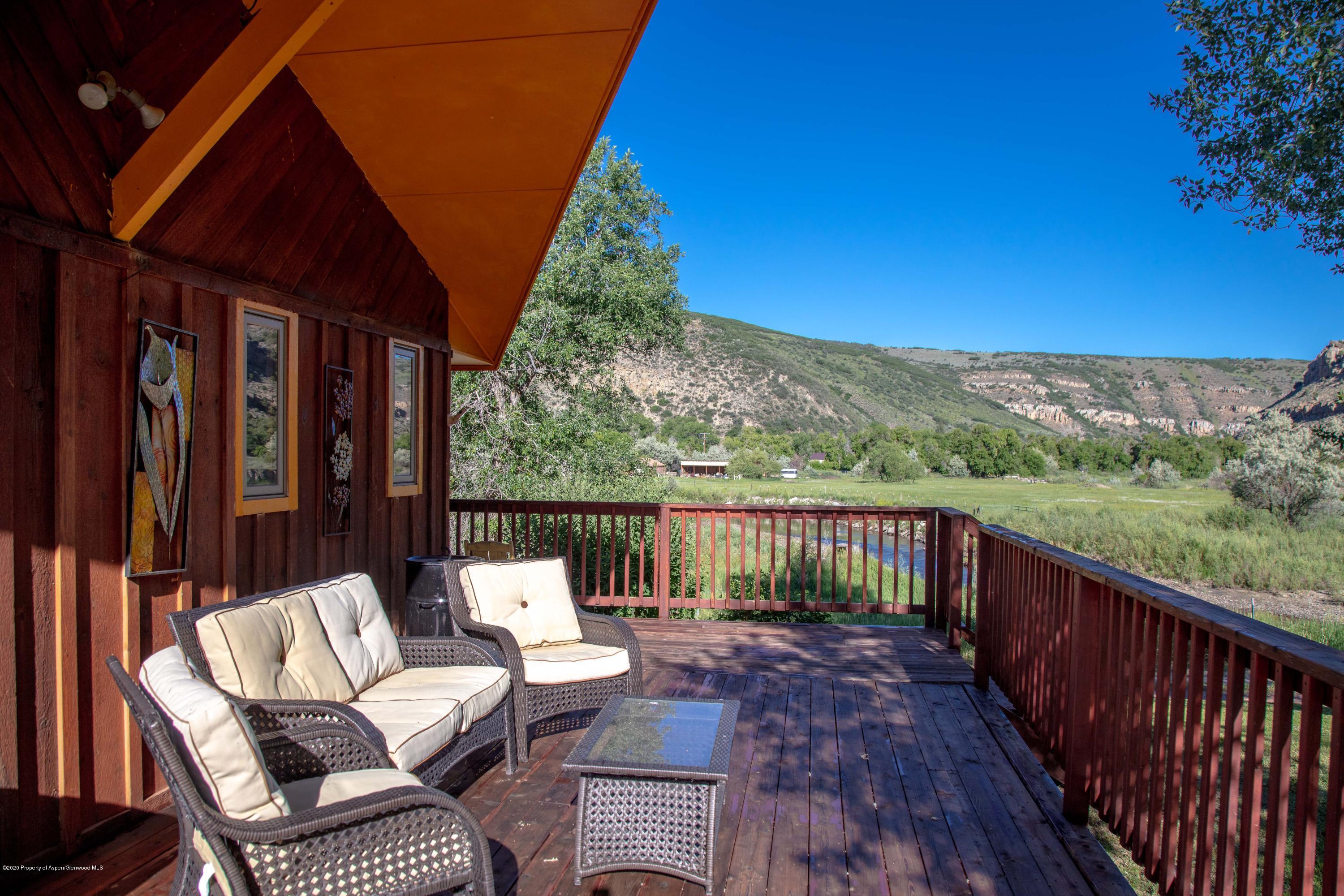 474 Highway 317 Hamilton, CO 81638 - Photo 21 of 31 a balcony with wooden floor and outdoor seating