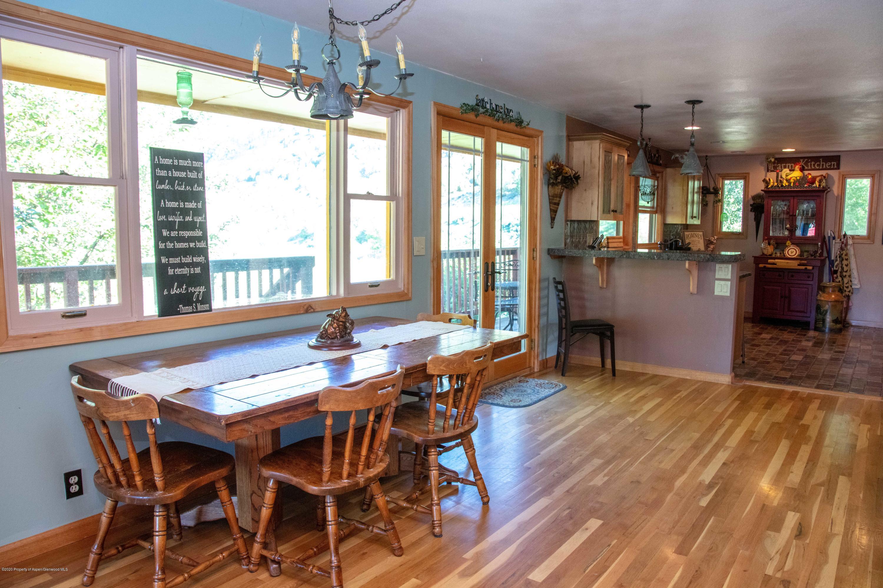 474 Highway 317 Hamilton, CO 81638 - Photo 8 of 31 a view of a dining room with furniture and window