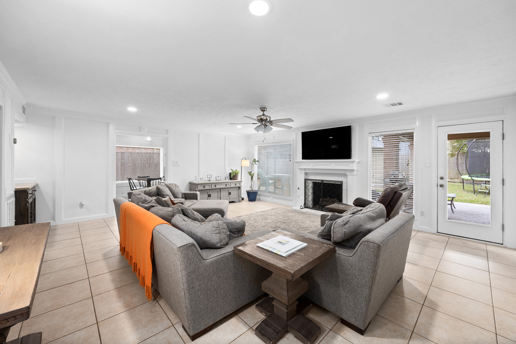 9123 Herts Road Spring, TX 77379 - Photo 15 of 40 The main living room offers access to the newly added extended covered back patio as well was the kitchen.
