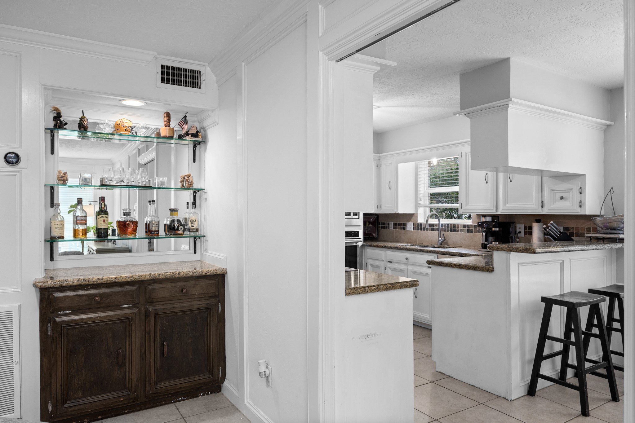 9123 Herts Road Spring, TX 77379 - Photo 16 of 40 Just past the corner bar is the entry into the generous kitchen area.