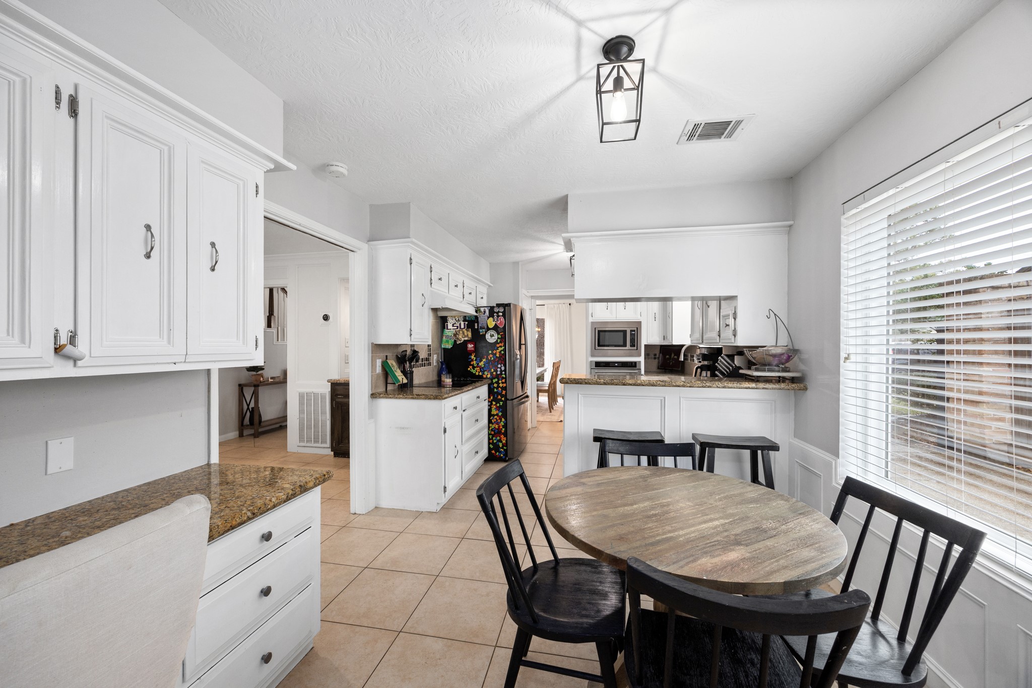9123 Herts Road Spring, TX 77379 - Photo 20 of 40 A look from the breakfast area toward the dining room.