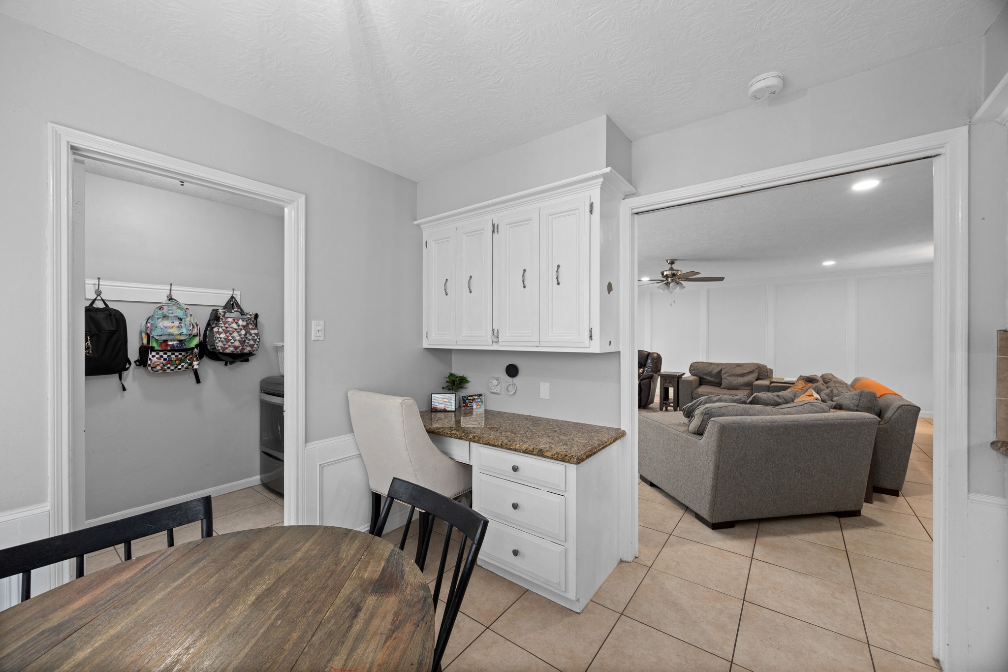 9123 Herts Road Spring, TX 77379 - Photo 22 of 40 Near the utility/mud room is the built in desk perfect for after school home work or weekly planning.