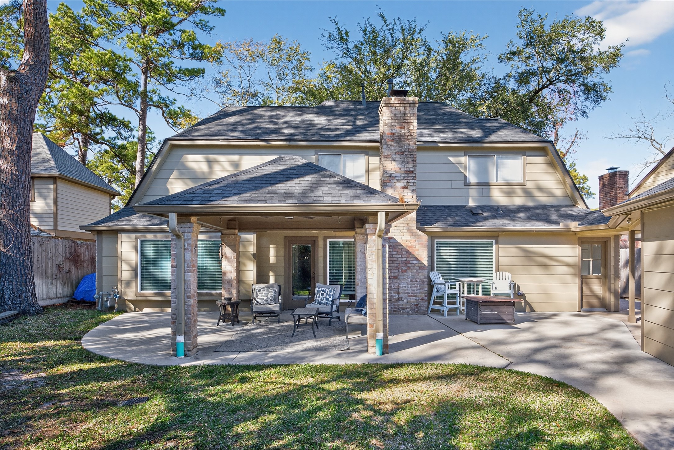 9123 Herts Road Spring, TX 77379 - Photo 35 of 40 The back yard is perfect for entertaining with the addition of the large covered patio and additional concrete patio space.