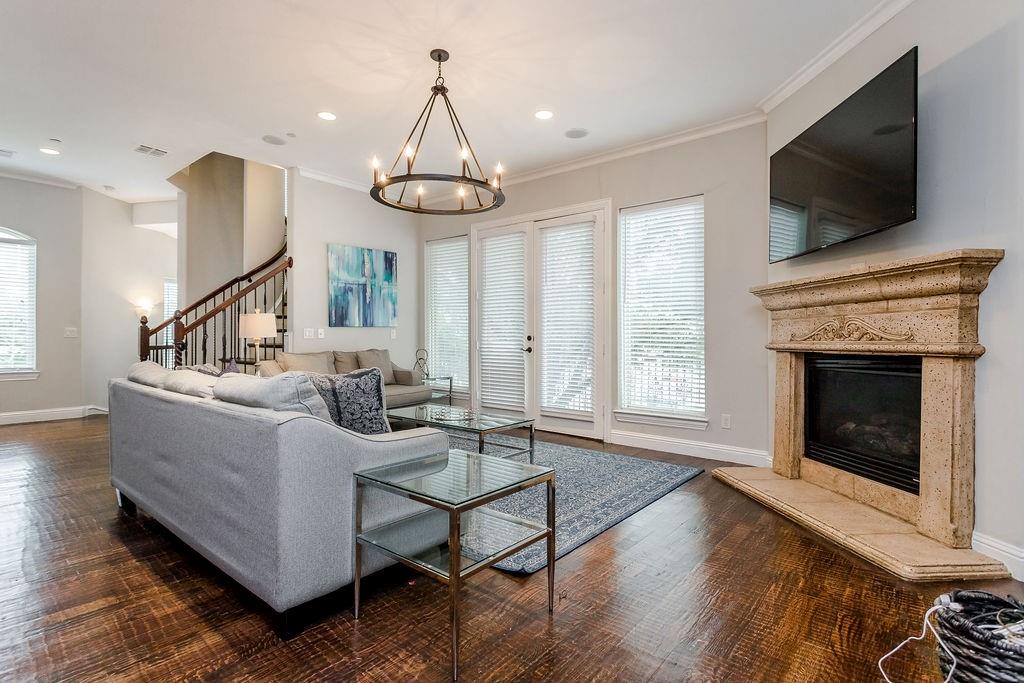 3817 Bowser Avenue, Unit A Dallas, TX 75219 - Photo 13 of 36 a living room with furniture fireplace and flat screen tv