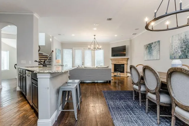 a living room with fireplace furniture and a flat screen tv