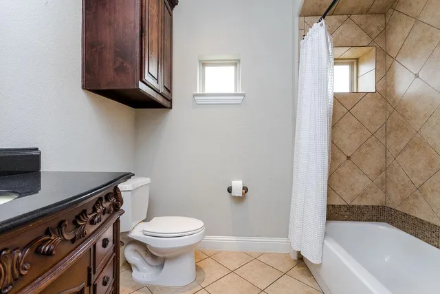 a bathroom with a toilet a sink and bathtub