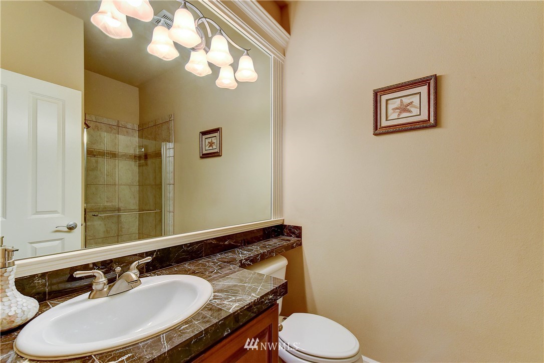 3704 Maple Road Lynnwood, WA 98037 - Photo 13 of 30 a bathroom with a granite countertop sink and a mirror