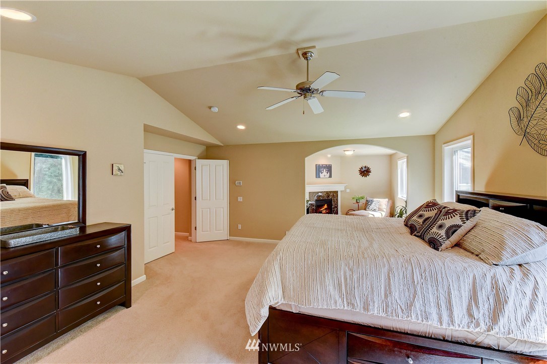 3704 Maple Road Lynnwood, WA 98037 - Photo 15 of 30 a bedroom with a large bed and a dresser
