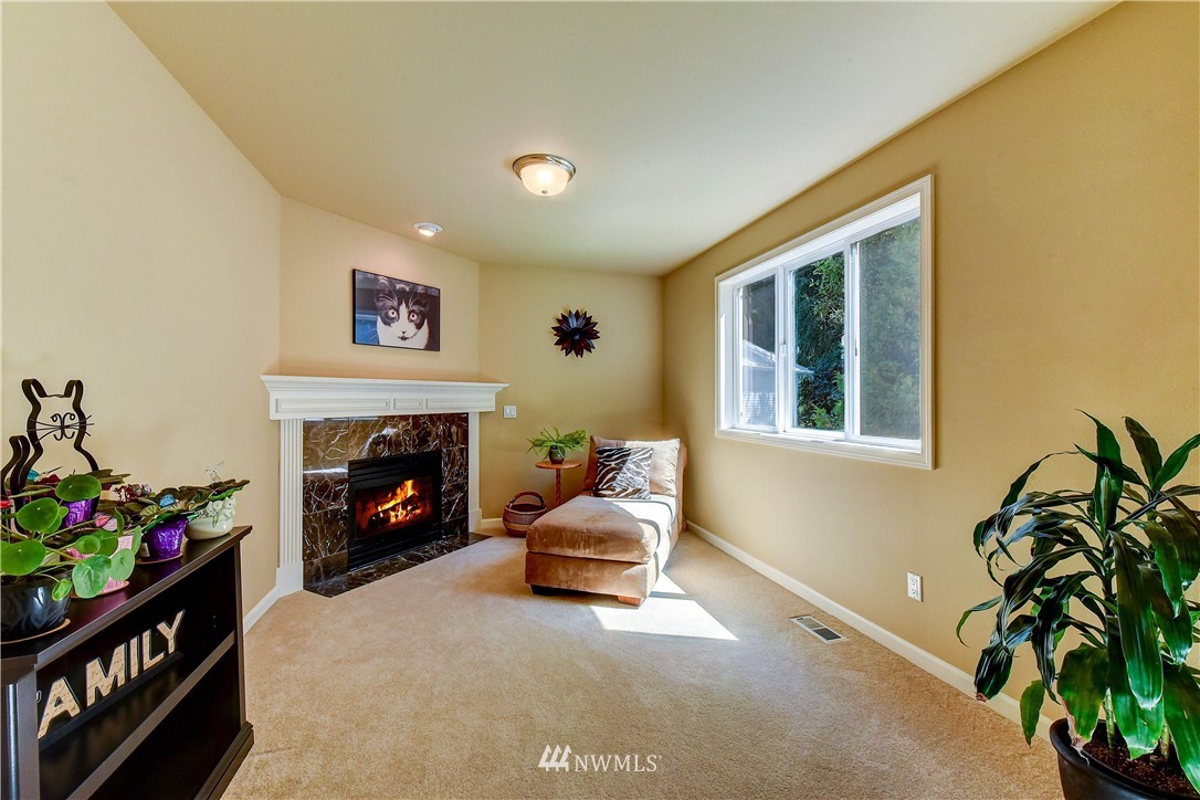 3704 Maple Road Lynnwood, WA 98037 - Photo 16 of 30 a living room with furniture and a fireplace