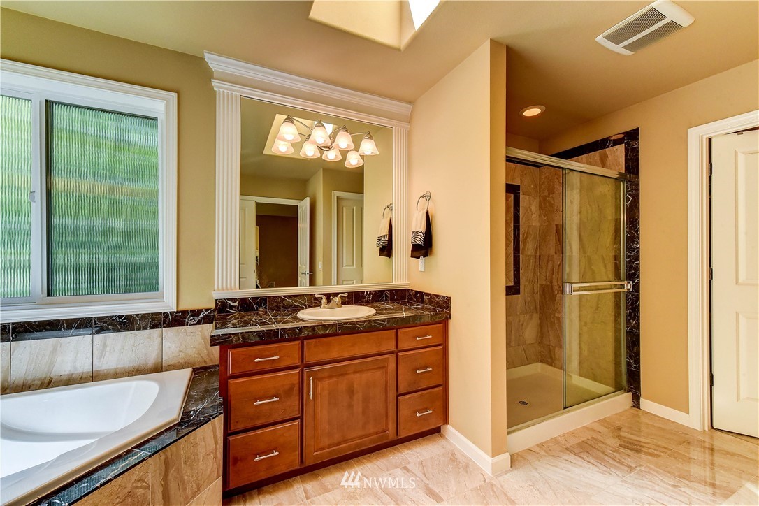 3704 Maple Road Lynnwood, WA 98037 - Photo 17 of 30 a bathroom with a granite countertop sink mirror and shower