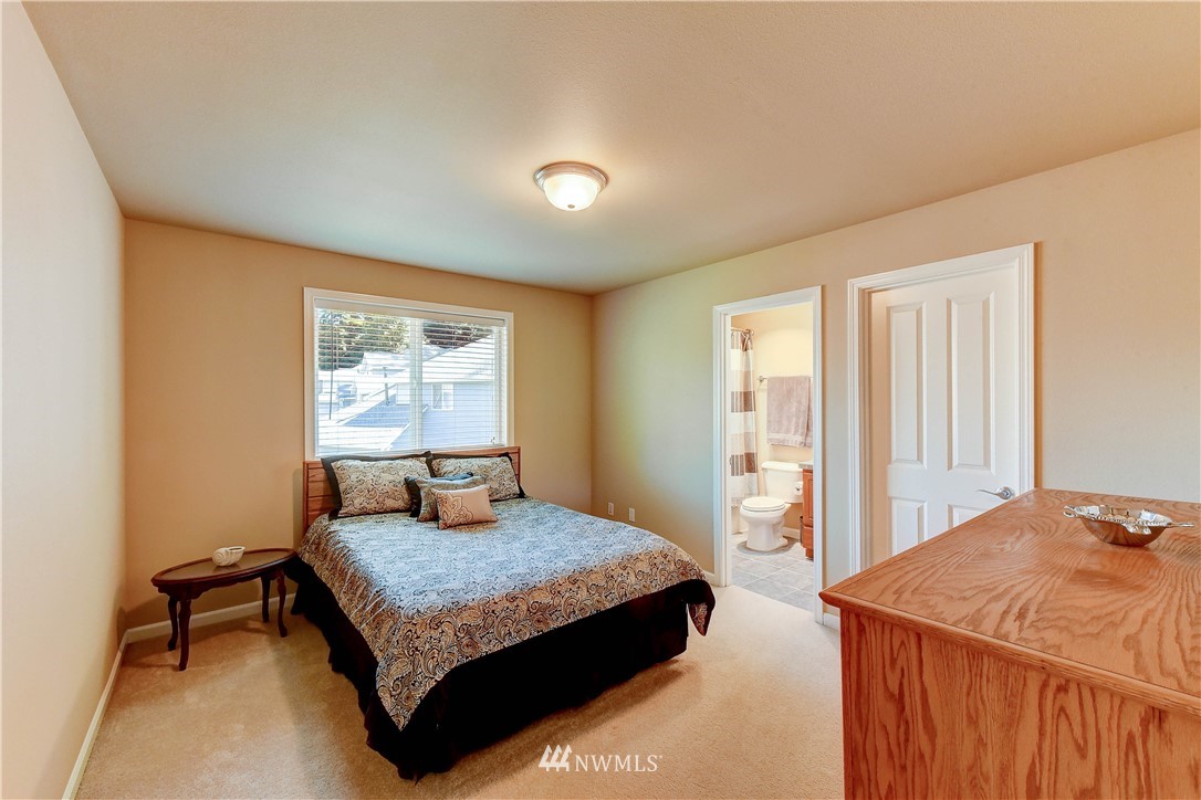 3704 Maple Road Lynnwood, WA 98037 - Photo 20 of 30 a bedroom with a bed and dresser