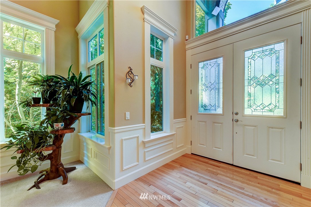 3704 Maple Road Lynnwood, WA 98037 - Photo 3 of 30 a view of an entryway with wooden floor and door