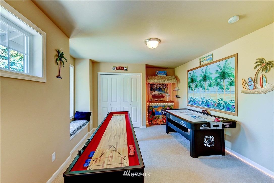 3704 Maple Road Lynnwood, WA 98037 - Photo 23 of 30 a room with furniture and a flat screen tv