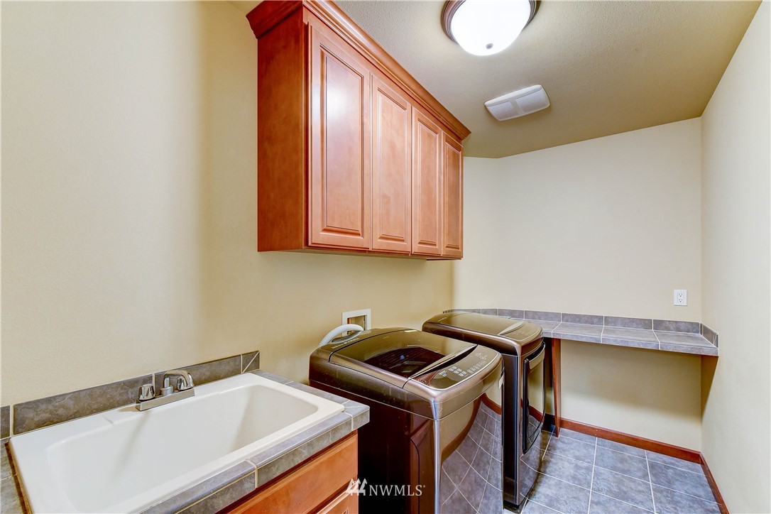 3704 Maple Road Lynnwood, WA 98037 - Photo 25 of 30 a utility room with dryer and washer