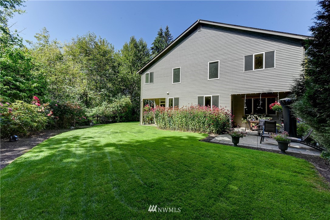 3704 Maple Road Lynnwood, WA 98037 - Photo 26 of 30 a view of a house with a yard and sitting area