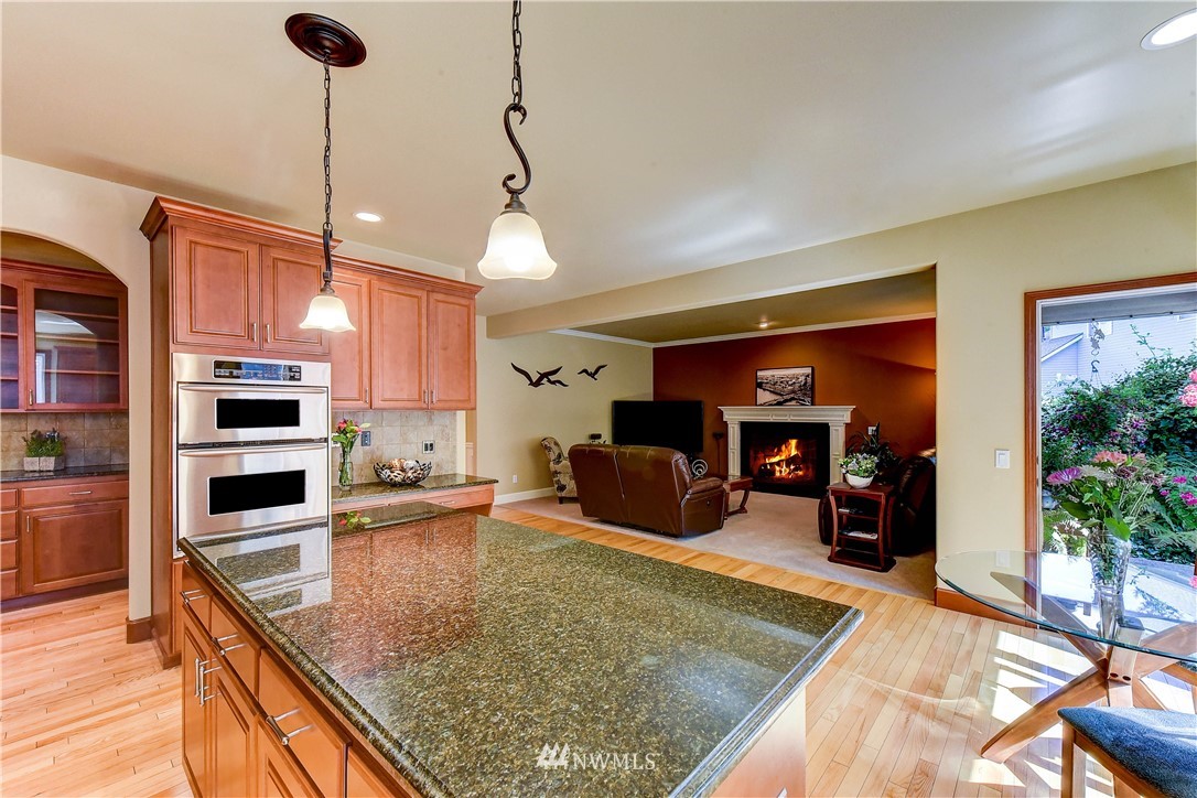3704 Maple Road Lynnwood, WA 98037 - Photo 6 of 30 a kitchen with stainless steel appliances granite countertop a sink counter space cabinets and furniture