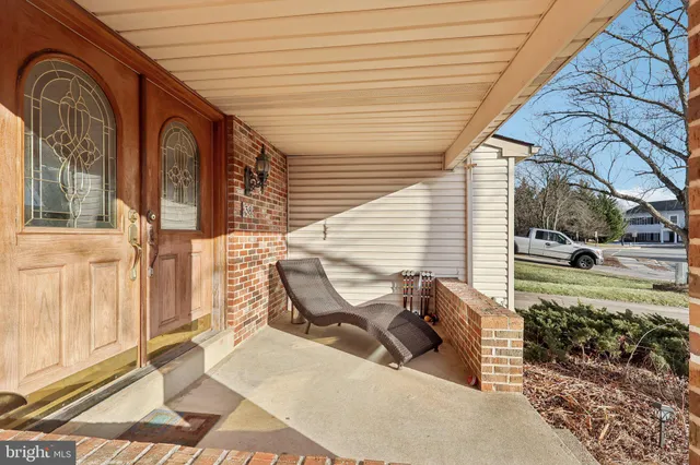 a view of a two chairs in the porch
