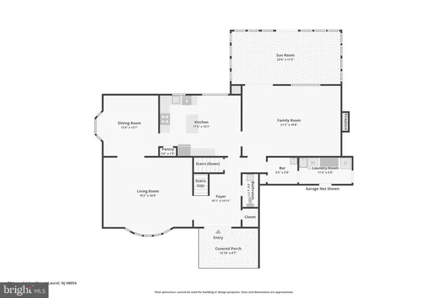 a view of a house with small yard plants and large tree