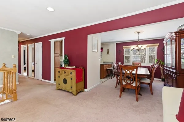 a kitchen with stainless steel appliances granite countertop a stove a sink dishwasher and a refrigerator