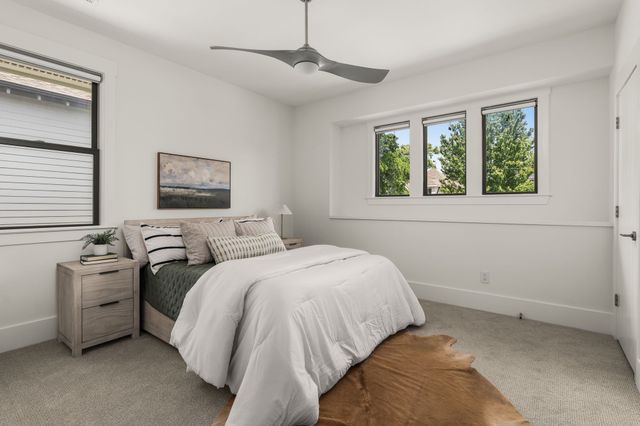 a bed room with a bed and a window