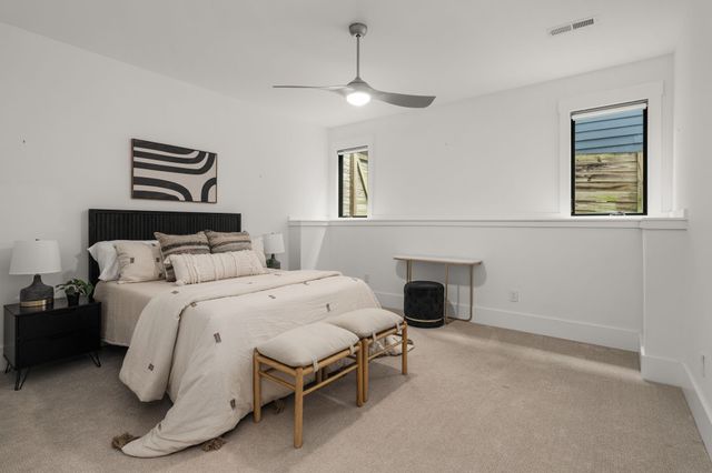 a bedroom with a bed and a fireplace